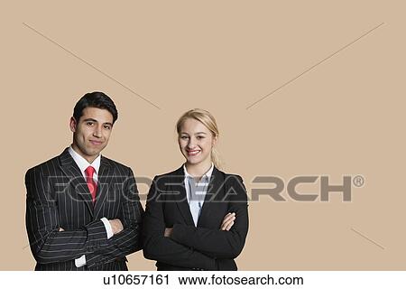 Portrait of young business team with arms crossed over colored background View Large Photo Image Stock Image - Portrait of young business team with arms crossed over colored background. Fotosearch