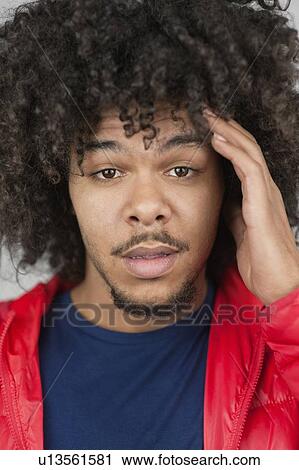 Portrait of young man with headache View Large Photo Image Stock Image - Portrait of young man with headache. Fotosearch