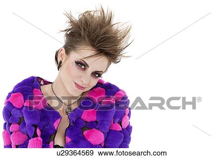 Stock Photo - Portrait of young punk woman over white background. Fotosearch