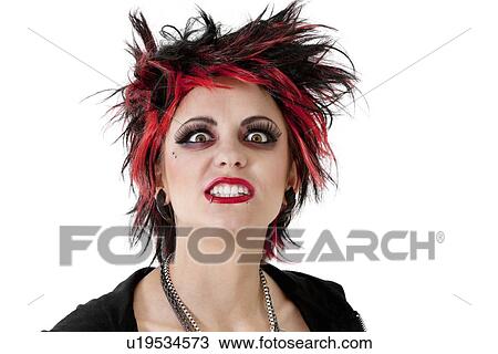Portrait of young woman showing teeth over white background View Large Photo Image Stock Image - Portrait of young woman showing teeth over white background. Fotosearch