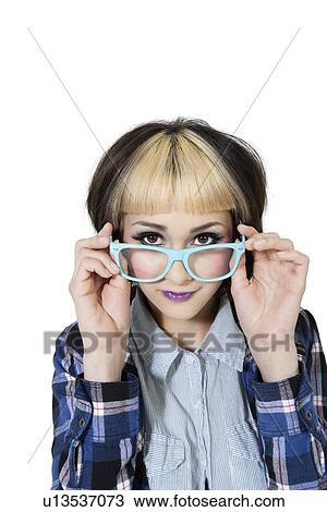 Portrait of young woman wearing eyeglasses over white background View Large Photo Image Stock Image - Portrait of young woman wearing eyeglasses over white background. Fotosearch