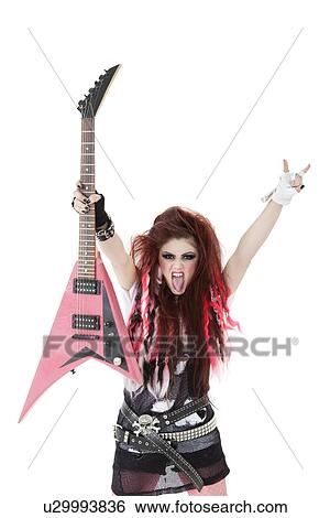 Portrait of young woman with sticking out tongue and holding electric guitar over white background View Large Photo Image Stock Photograph - Portrait of young woman with sticking out tongue and holding electric guitar over white background. Fotosearch