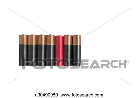 Stock Image - Red amid black batteries over white background. Fotosearch