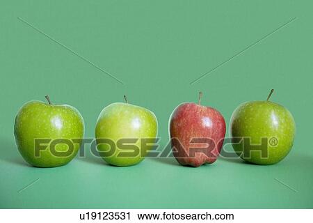 Row of red and green apples over colored background View Large Photo Image Stock Image - Row of red and green apples over colored background. Fotosearch