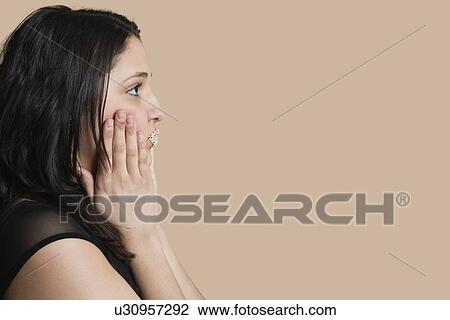 Side view of young woman with sprinkled lips over colored background View Large Photo Image Stock Image - Side view of young woman with sprinkled lips over colored background. Fotosearch