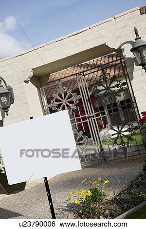 Signboard in front of entrance gate View Large Photo Image Stock Photograph - Signboard in front of entrance gate. Fotosearch