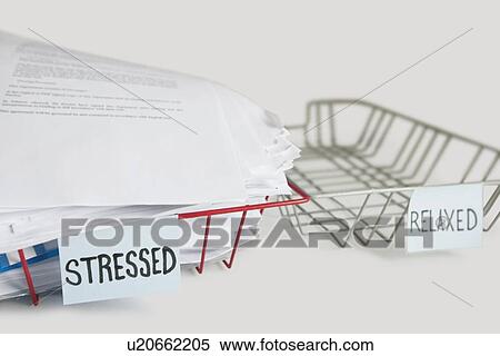 Stack of paperwork in stressed tray with empty relaxed platter over white background View Large Photo Image Stock Photography - Stack of paperwork in stressed tray with empty relaxed platter over white background. Fotosearch