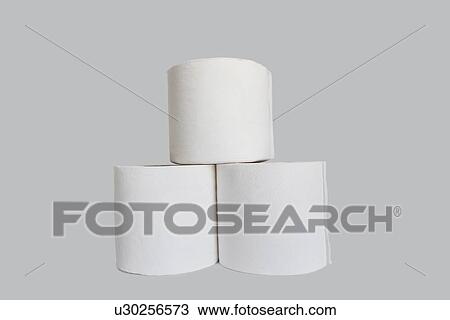 Stock Image - Stacks of rolls of toilet paper on white background. Fotosearch