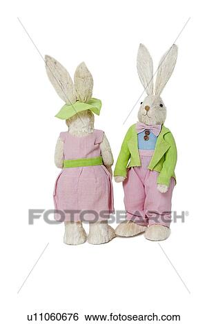 Stock Photograph - Stuffed toys looking different ways after an argument over white background. Fotosearch