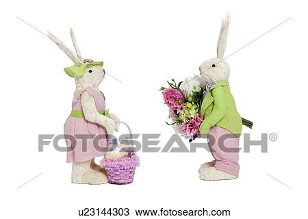 Stuffed toys portrayed as male with flowers and female with basket over white background View Large Photo Image Stock Image - Stuffed toys portrayed as male with flowers and female with basket over white background. Fotosearch