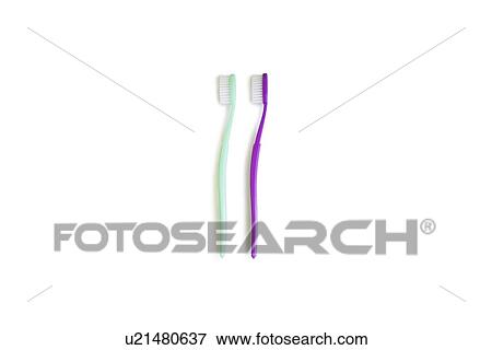 Two toothbrushes over white background View Large Photo Image Stock Photo - Two toothbrushes over white background. Fotosearch