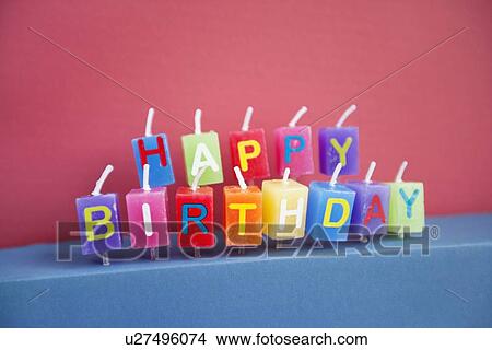 Picture - Unlit birthday candles over colored background. Fotosearch