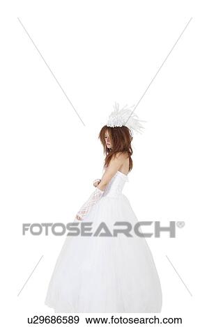 Stock Photo - Young bride in wedding dress over white background. Fotosearch