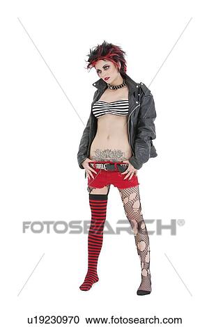 Young punk rock woman standing over white background View Large Photo Image Stock Image - Young punk rock woman standing over white background. Fotosearch