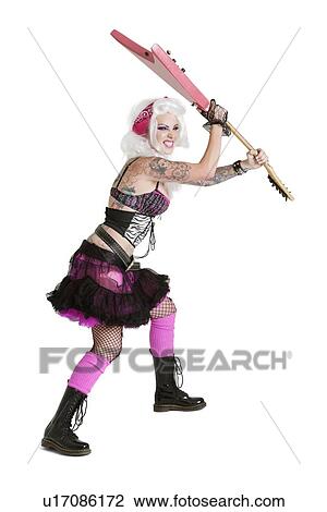 Young punk woman about to wreck guitar over white background View Large Photo Image Stock Image - Young punk woman about to wreck guitar over white background. Fotosearch
