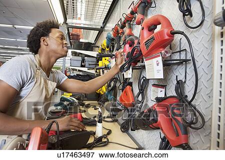 African American man working in an electronics store View Large Photo Image Stock Photo - African American man working in an electronics store. Fotosearch
