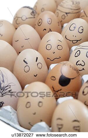 Anthropomorphic brown eggs arranged in carton against white background View Large Photo Image Stock Photo - Anthropomorphic brown eggs arranged in carton against white background. Fotosearch