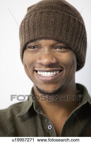 Close-up of a cheerful African American man wearing knit hat View Large Photo Image Stock Image - Close-up of a cheerful African American man wearing knit hat. Fotosearch