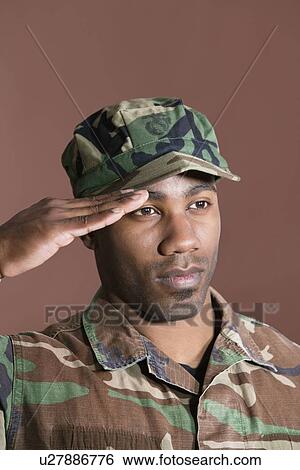 Close-up of a young African American US Marine Corps soldier saluting over brown background View Large Photo Image Stock Photograph - Close-up of a young African American US Marine Corps soldier saluting over brown background. Fotosearch