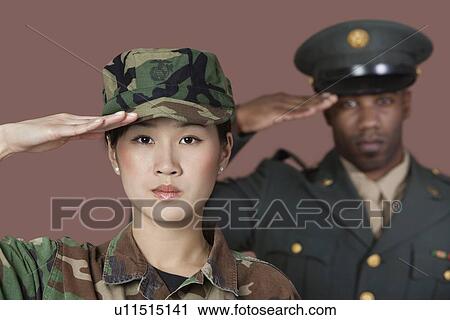 Close-up portrait of young female US Marine Corps soldier with male officer saluting over brown background View Large Photo Image Stock Image - Close-up portrait of young female US Marine Corps soldier with male officer saluting over brown background. Fotosearch