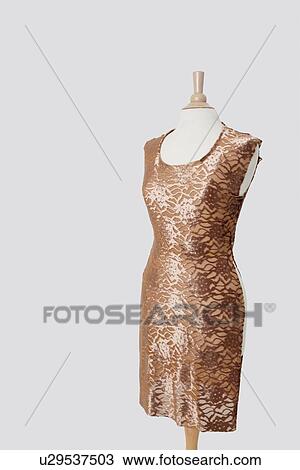 Dress on tailor's dummy over gray background View Large Photo Image Stock Image - Dress on tailor's dummy over gray background. Fotosearch