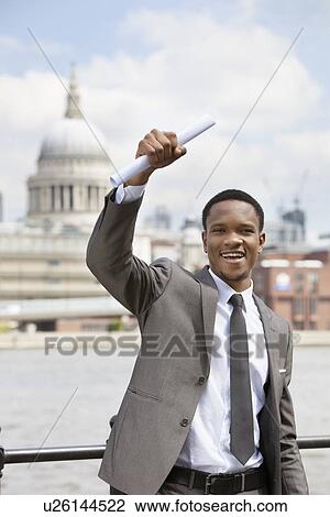 Excited African American businessman with St. Paul's Cathedral in the background View Large Photo Image Stock Image - Excited African American businessman with St. Paul's Cathedral in the background. Fotosearch
