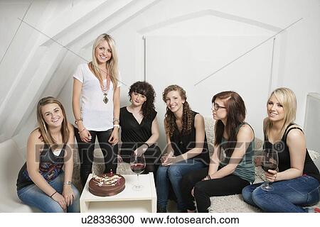 Female friends celebrating young woman's birthday View Large Photo Image Stock Image - Female friends celebrating young woman's birthday. Fotosearch