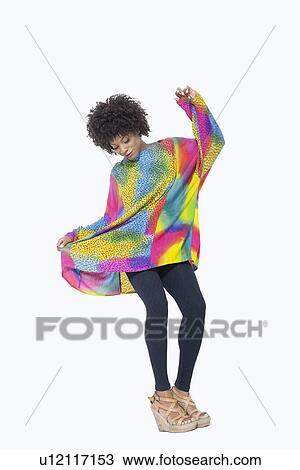 Full length of an African American woman in dashiki over gray background View Large Photo Image Stock Image - Full length of an African American woman in dashiki over gray background. Fotosearch