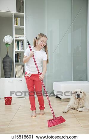 Girl sweeping the floor View Large Photo Image Stock Image - Girl sweeping the floor . Fotosearch