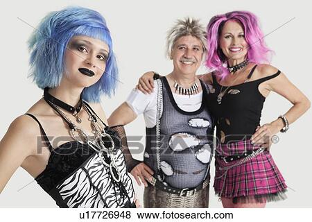 Group portrait of young female punk with senior couple standing in background View Large Photo Image Stock Photo - Group portrait of young female punk with senior couple standing in background. Fotosearch