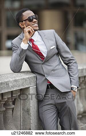 Happy young African American businessman wearing sunglasses View Large Photo Image Stock Image - Happy young African American businessman wearing sunglasses. Fotosearch