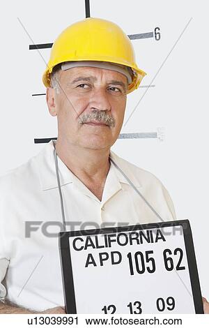 Mug shot of senior male constructor looking away View Large Photo Image Stock Image - Mug shot of senior male constructor looking away. Fotosearch