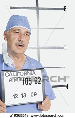 Stock Image - Mug shot of senior male surgeon. Fotosearch