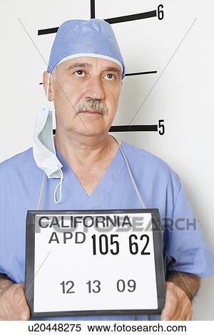 Mug shot of senior male surgeon View Large Photo Image Stock Photography - Mug shot of senior male surgeon. Fotosearch