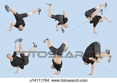 Multiple image of young man break dancing over light blue background View Large Photo Image Picture - Multiple image of young man break dancing over light blue background. Fotosearch