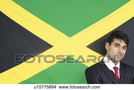 Portrait of a confident businessman against Jamaican flag View Large Photo Image Picture - Portrait of a confident businessman against Jamaican flag. Fotosearch