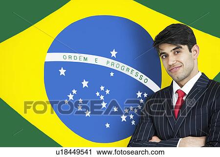 Portrait of a confident Indian businessman against Brazilian flag View Large Photo Image Stock Image - Portrait of a confident Indian businessman against Brazilian flag. Fotosearch