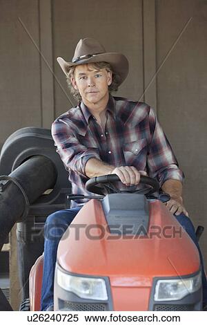 Portrait of a cowboy driving utility vehicle View Large Photo Image Stock Photography - Portrait of a cowboy driving utility vehicle. Fotosearch
