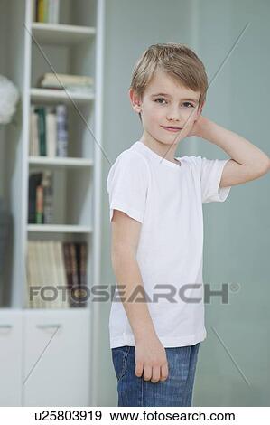 Portrait of a little boy in casuals at home View Large Photo Image Stock Photo - Portrait of a little boy in casuals at home. Fotosearch