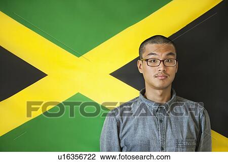 Portrait of a man with raised eyebrows against Jamaican flag View Large Photo Image Stock Image - Portrait of a man with raised eyebrows against Jamaican flag. Fotosearch