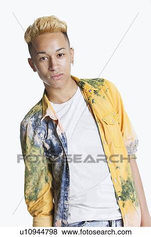 Portrait of a teenage boy with blond hair over gray background View Large Photo Image Stock Photo - Portrait of a teenage boy with blond hair over gray background. Fotosearch