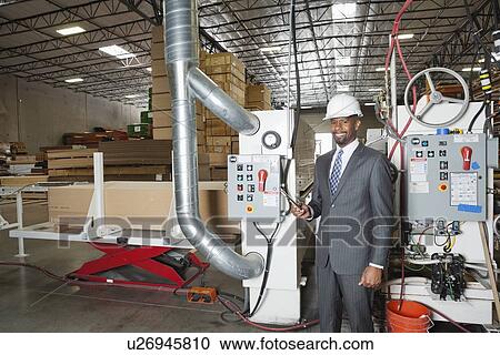 Portrait of an African American male engineer in timber factory View Large Photo Image Stock Image - Portrait of an African American male engineer in timber factory. Fotosearch