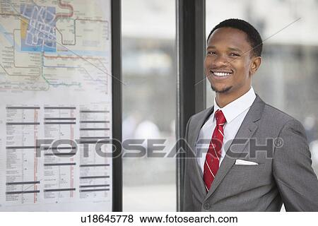 Stock Photo - Portrait of an African American young businessman smiling. Fotosearch