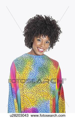 Portrait of an attractive African American woman in multicolored dashiki standing over gray background View Large Photo Image Stock Image - Portrait of an attractive African American woman in multicolored dashiki standing over gray background. Fotosearch