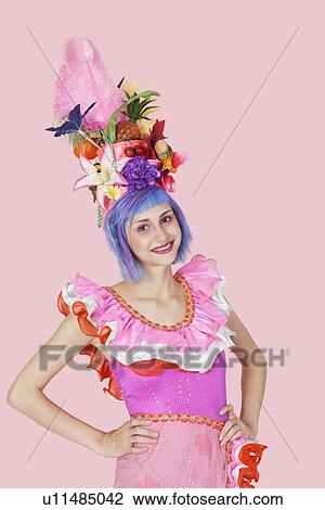 Portrait of beautiful young woman in Brazilian outfit over pink background View Large Photo Image Stock Image - Portrait of beautiful young woman in Brazilian outfit over pink background. Fotosearch