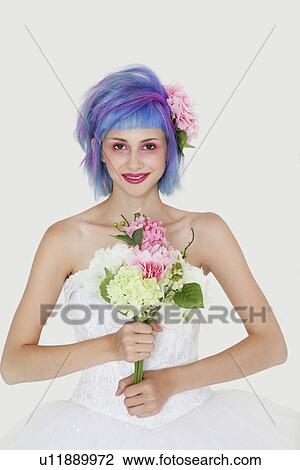 Portrait of beautiful young woman in wedding dress with dyed hair against gray background View Large Photo Image Stock Image - Portrait of beautiful young woman in wedding dress with dyed hair against gray background. Fotosearch