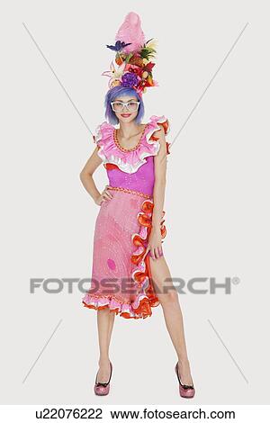 Stock Image - Portrait of beautiful young woman in Brazilian outfit over gray background. Fotosearch