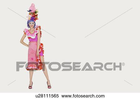 Stock Photography - Portrait of beautiful young woman in Brazilian outfit over gray background. Fotosearch