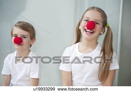 Stock Photo - Portrait of children wearing clown noses. Fotosearch