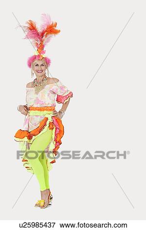 Portrait of happy senior woman in Brazilian outfit against gray background View Large Photo Image Stock Photo - Portrait of happy senior woman in Brazilian outfit against gray background. Fotosearch